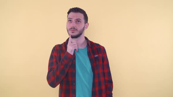 Thoughtful Man Scratching His Chin Thinking and Looking on the Side alt