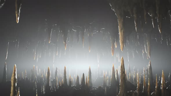 Journey through an underground cave full of stalactites and stalagmites. 4KHD alt