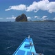Traditional Banca Boat Float Towards Pinagbuyatan Island. A Small Island with Huge Limestone Cliffs - VideoHive Item for Sale