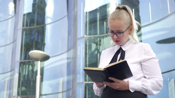 business woman makes entries in the diary