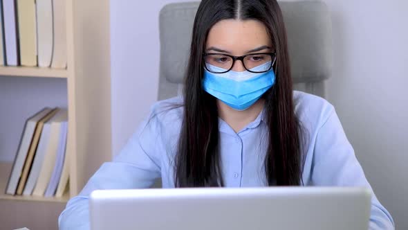 Businesswoman with Mask on Her Face Working