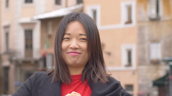 Asian pretty woman smiling at camera- outdoor alt