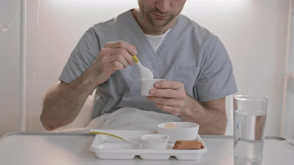 Person Eating Hospital Food alt