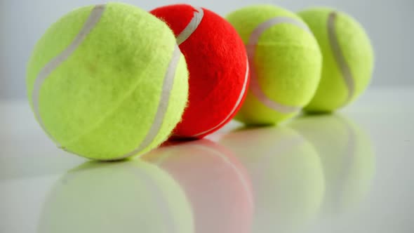 Tennis balls arranged in row 4k alt