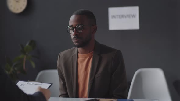 Young Black Man Speaking with HR Manager on Job Interview, Stock Footage