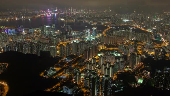 Hong Kong Urban Cityscape Aerial Skyline Panorama Timelapse at Night Pan Up alt