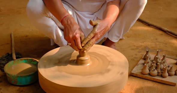 Pottery - Skilled Wet Hands of Potter Shaping the Clay on Potter Wheel. Pot, Vase Throwing alt