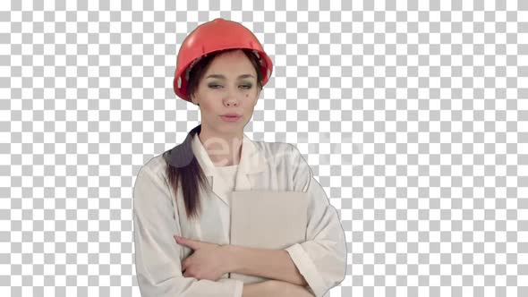 Female architect in hardhat holding tablet, Alpha Channel