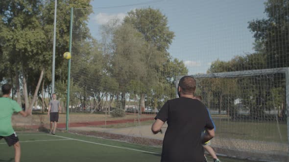 Footballer Heading Ball To Score Goal on Pitch alt