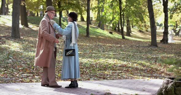 Elegant Elderly Married Couple in Love Dancing in Autumn Park alt