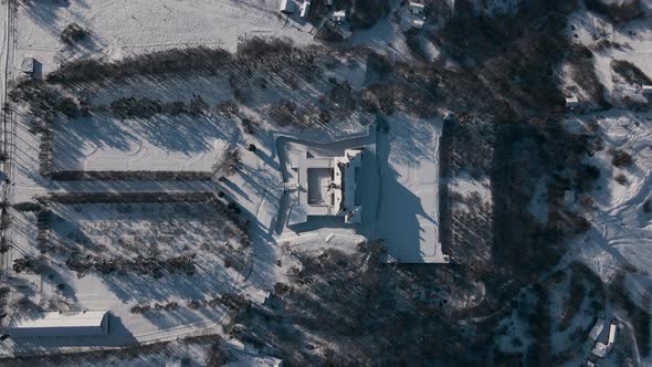 Top Down Aerial View Drone Flight Over the Historic Old Castle at Sunny Winter Day Pidhirtsi Palace