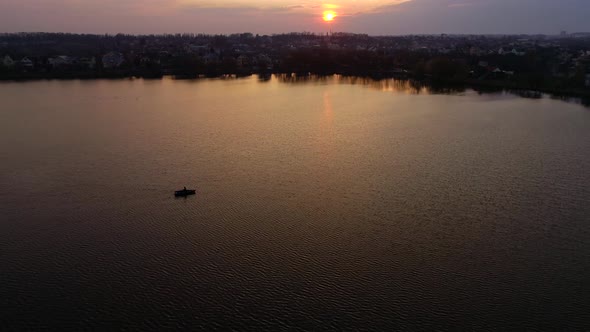 Cityline, Boat And Lake On Sunset