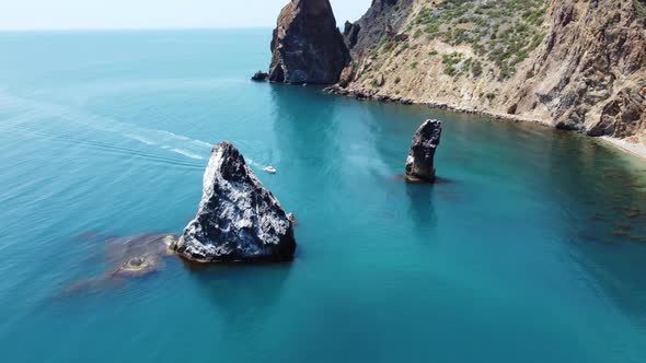 Aerial View From Above on Azure Sea and Volcanic Rocky Shores alt