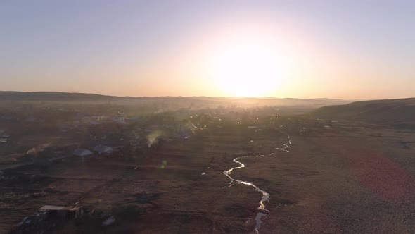Flying Over Small Village In Spring Sun alt