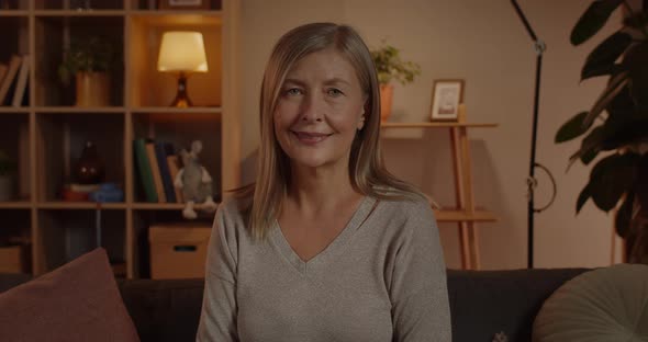 Close Up View of Mature Happy Woman Looking To Camera alt