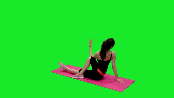 Slender Girl in Black Bodysuit Doing Yoga against Green Screen 