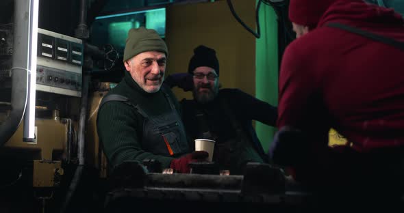 Male Fishers Drinking and Discussing Work alt