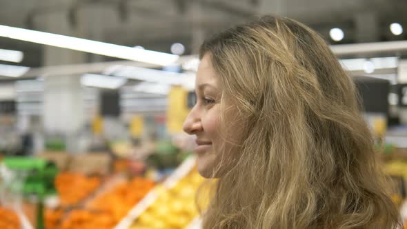 Girl Takes Off Mask in Supermarket Close-up, Stop Covid-19 alt