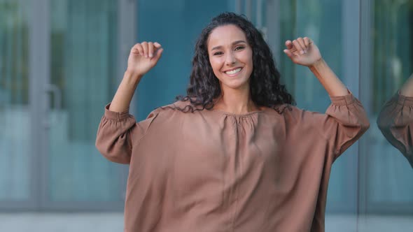 Happy Active Female Dancer Hispanic Woman Girl with Long Hair Beautiful Lady Dances with Hands alt