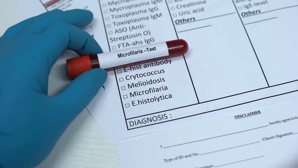 Microfilaria, Doctor Checking Name in Lab Blank, Showing Blood Sample in Tube