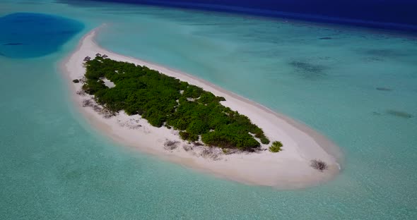 Daytime above travel shot of a white paradise beach and blue water background in best quality 4K alt
