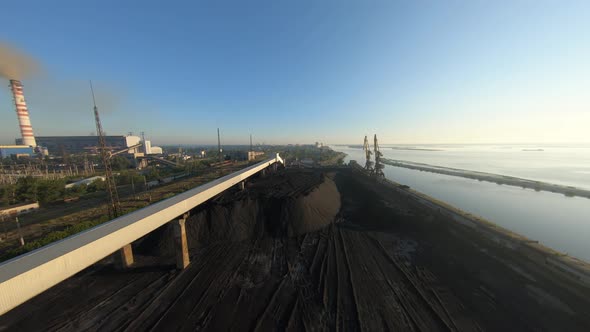 FPV Drone View Flight Over Coal Delivery Terminal with Port Cranes for Thermal Power Plant