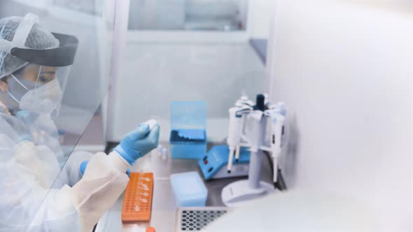 Female Scientist Makes PCR DNA Tests in a Modern Chemical and Bacteriological Laboratory alt