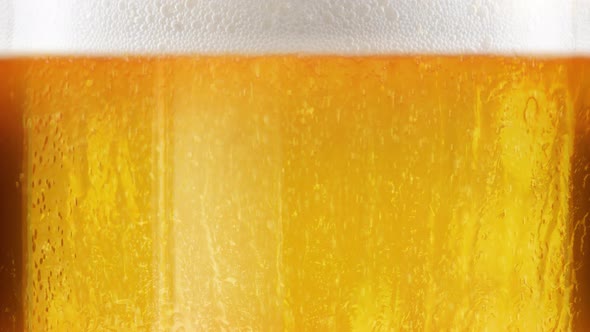 Glass of beer detailed macro loop alt