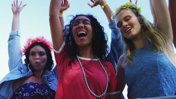 Female friends having fun at music festival  alt
