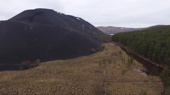 Aerial View of Huge Metallurgical Black Slag Dumps alt