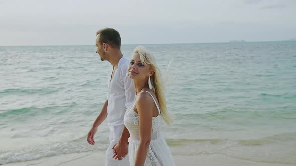 Couple Walking on Beach alt