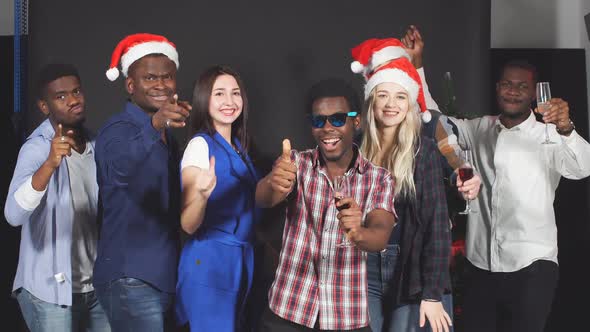 Young Mixed Race Friends Dancing at Christmas Party in Studio