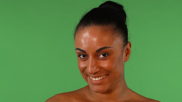 Beautiful African Woman Looking To the Camera Playfully alt