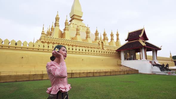 lao culture of woman at that luang stupa