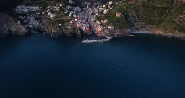 Aerial view reveals dramatic mountainous setting of Riomaggiore, Italy alt