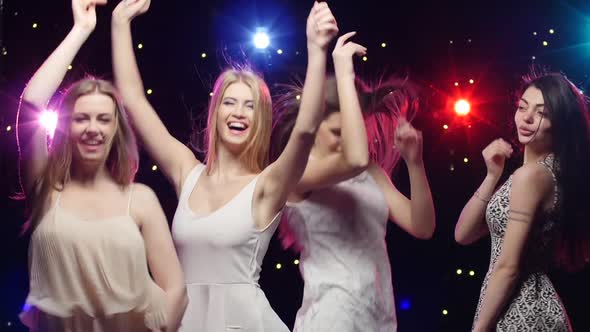 Four Girls Dancing Together and Blowing Kisses in a Disco, Stock Footage