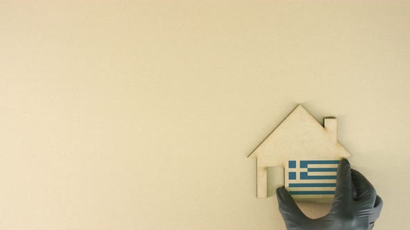 Cardboard House Icon with Flag of Greece