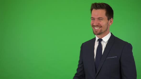 A Young Handsome Businessman Celebrates - Green Screen Studio alt
