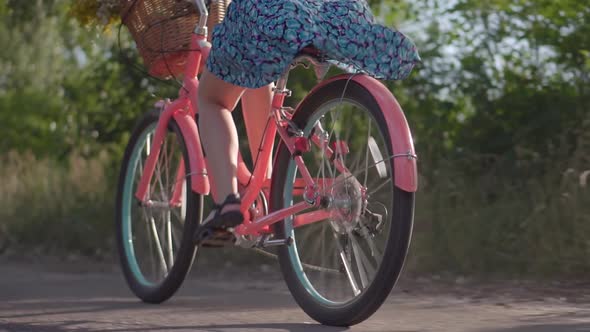Cyclist Girl Wearing Dress Workout. Hair Blowing When Cycling. .Hair Blowing On Cycling. alt