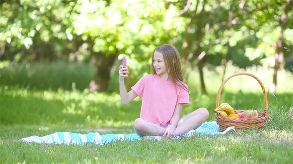 Little Girl in Yoga Position in the Park. alt