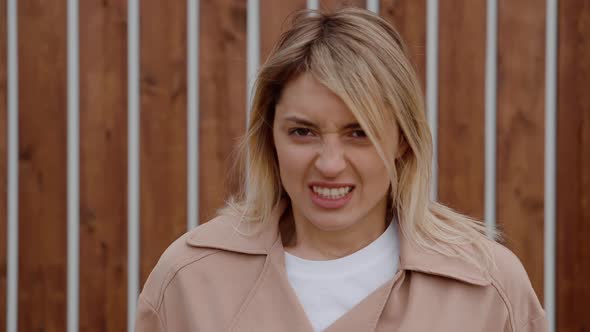 Young Blonde Girl Showing Anger alt