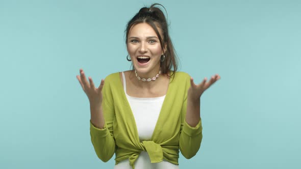 Slow Motion of Excited European Girl Winning Prize and Shaking Hands with Happiness and Disbelief alt