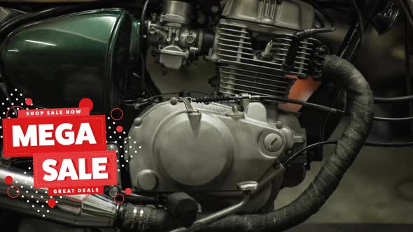 Animation of mega sale text in white and red over motorbike engine alt