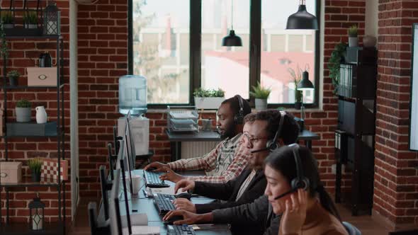 Diverse Group of Workers Talking to Clients at Customer Service alt