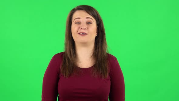 Portrait of Pretty Girl Says Wow, Waves Her Head Approvingly . Green Screen alt