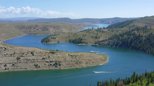 Flying over Strawberry Reservoir in Utah with boats enjoying the summer day alt