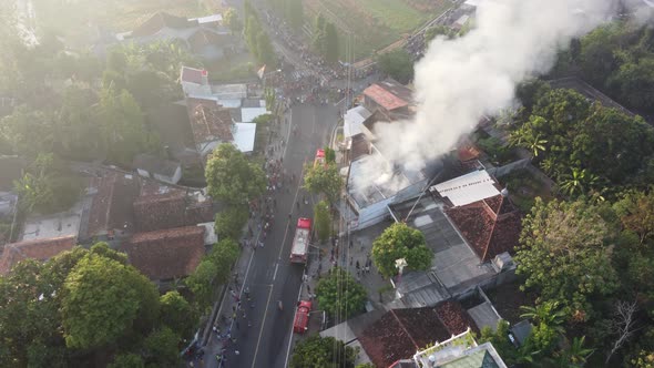 Aerial view of house fires in densely populated settlements in Indonesia alt