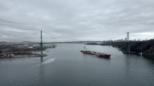 Aerial landscape view of Lions Gate Bridge in Vancouver, Canada, on a cloudy evening alt