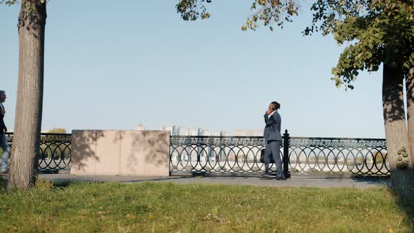 Diverse Group of People Moving in City Street Walking Riding Bike Jogging on Summer Day alt
