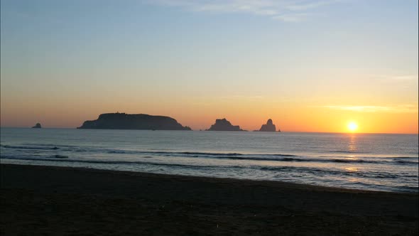Unspoiled Mediterranean Beach and Islands at Sunrise
